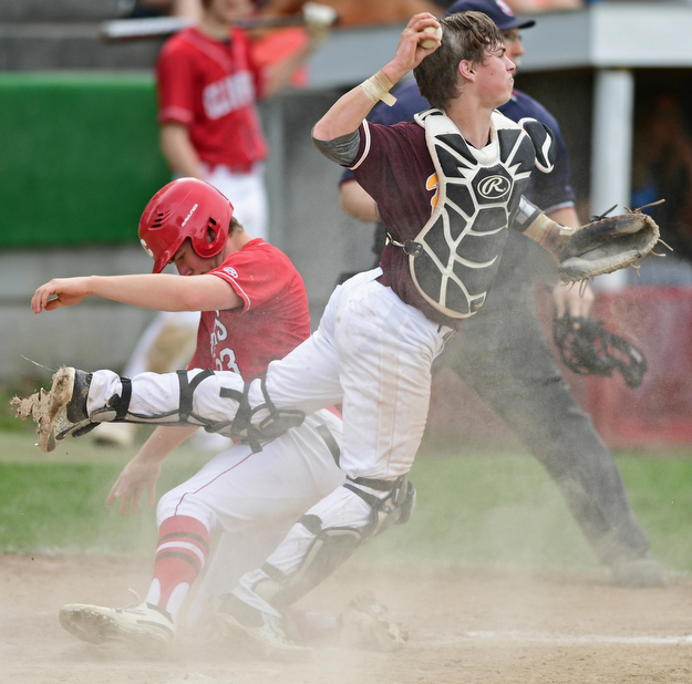 COLUMBIANA, OHIO - APRIL 20, 2017: South Range's M.J. Lucas, right, was an off balance throw to third base after tagging out Columbiana's A.J. Perkins at home in the fifth inning of Thursday evenings game at Firestone Park. Columbiana won 4-2. DAVID DERMER | THE VINDICATOR