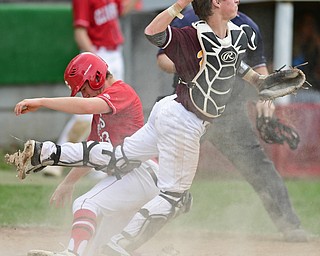 COLUMBIANA, OHIO - APRIL 20, 2017: South Range's M.J. Lucas, right, was an off balance throw to third base after tagging out Columbiana's A.J. Perkins at home in the fifth inning of Thursday evenings game at Firestone Park. Columbiana won 4-2. DAVID DERMER | THE VINDICATOR