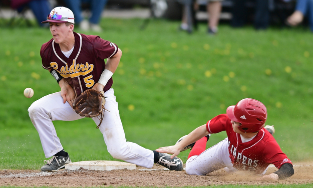 COLUMBIANA, OHIO - APRIL 20, 2017: South Range's Brycen James, left, blocks the ball while Columbiana's Zach Fans slides into third in the fifth inning of Thursday evenings game at Firestone Park. Columbiana won 4-2. DAVID DERMER | THE VINDICATOR