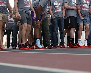 Men line up to start a Walk a Mile in Her Shoes at the Watts and Tressel Training Site at Youngstown State University, Friday, April 21, 2017 in Youngstown. ..(Nikos Frazier | The Vindicator)..