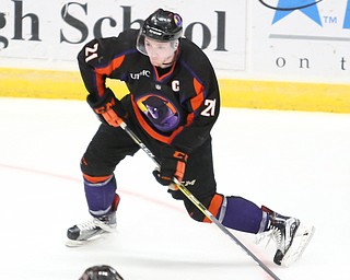 Youngstown Phantoms left wing Tommy Apap (21) puts a shot into the goal against Chicago Steel goalie Ales Stezka (30) during the 2nd period as the Chicago Steel takes on the Youngstown Phantoms in the USHL Eastern Conference Semifinals, Friday, April 21, 2017 at The Covelli Centre...(Nikos Frazier | The Vindicator)..