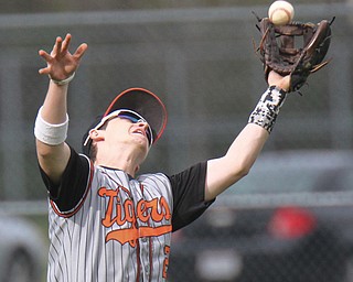 William D.Lewis The vindicator  Howland's Zachary Campbell(2) pulls in a fly ball during 4-21-17 game with Girard at Howland.