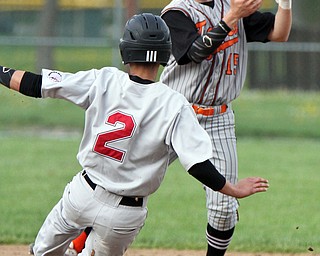 William D. Lewis The Vindicator Giard's Austin Claussell(2) is out at 2nd as Howland's Frank Rappach(15) tries to turn a double play during 4-21-17 action at Howland.