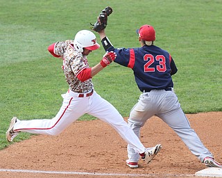 William D Lewis The Vindicator  YSU's Lorenzo Arcuri(9) is out at 1rst as UIC's Ricardo Rameriz(23) make the catch during 4-22-17 game at Eastwood.