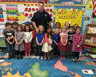 SPECIAL TO THE VINDICATOR
Daryn Tallman, a Boardman Police officer and member of the K-9 unit, visited Tammy Romeo’s class at Ursuline Preschool & Kindergarten as part of community helpers month. Tallman talked about how police officers help keep the community safe. Tallman’s daughter, Anna, is one of the students in the class.
