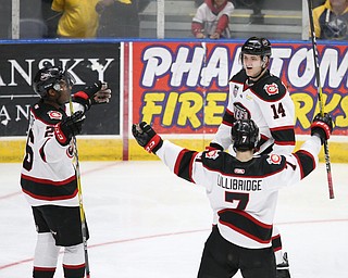 Chicago Steel right wing Marc Johnstone (26), Chicago Steel defenseman Graham Lillibridge (7) and Chicago Steel left wing Eduards Tralmaks (14) celebrate a goal in the 3rd period as the Chicago Steel takes on the Youngstown Phantoms in Game 4 of the USHL Eastern Conference Semifinals, Saturday, April 22, 2017 at The Covelli Centre in Youngstown. The Phantoms won 3-2...(Nikos Frazier | The Vindicator)..