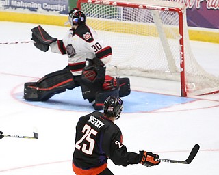 Youngstown Phantoms center Evan Wisocky (25) watches his shot go into the net as Chicago Steel goalie Ales Stezka (30) watches his water bottle fly into the air during the 3rd period as the Chicago Steel takes on the Youngstown Phantoms in Game 4 of the USHL Eastern Conference Semifinals, Saturday, April 22, 2017 at The Covelli Centre in Youngstown. The Phantoms won 3-2...(Nikos Frazier | The Vindicator)..