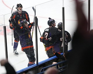 Phantoms' Youngstown Phantoms right wing Alex Esposito (23), Youngstown Phantoms center Nicolas Werbik (13), and Youngstown Phantoms defenseman Dominic Dockery (18) celebrate Youngstown Phantoms center Evan Wisocky (25)'s goal  during the 3rd period as the Chicago Steel takes on the Youngstown Phantoms in Game 4 of the USHL Eastern Conference Semifinals, Saturday, April 22, 2017 at The Covelli Centre in Youngstown. The Phantoms won 3-2...(Nikos Frazier | The Vindicator)..