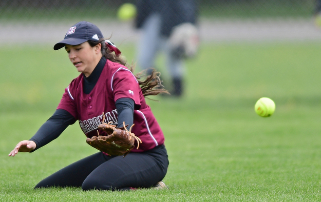 BOARDMAN, OHIO - APRIL 22, 2017: Boardman's Ashley Saxton (22) falls to the ground after unsuccessfully diving to catch the ball, allowing a run to score in the third inning of Saturday mornings game at Boardman High School. DAVID DERMER | THE VINDICATOR