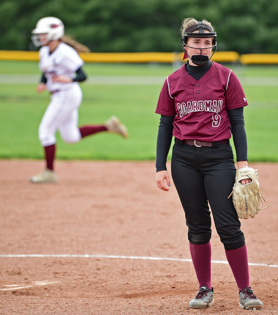 BOARDMAN, OHIO - APRIL 22, 2017: Boardman starting Ashley Cornelius, front, shows her frustration while looking into the dugout after allowing a grand slam to Mooney's Conchetta Rinaldi in the third inning of Saturday mornings game at Boardman High School. DAVID DERMER | THE VINDICATOR