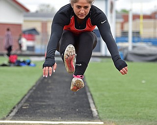 AUSTINTOWN, OHIO - APRIL 22, 2017: Springfield's Shantel Springer flies through the air during the field long jump, Saturday afternoon during the Mahoning Country Track Meet at Austintown Fitch High School. DAVID DERMER | THE VINDICATOR