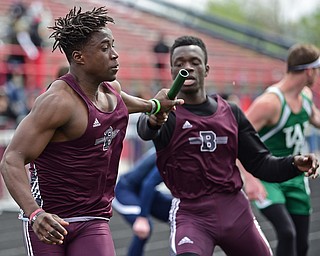 AUSTINTOWN, OHIO - APRIL 22, 2017: Boardman's Koby Adu-Poku receives the baton from teammate Ari Ojewalo during the boys 4x100 meter dash, Saturday afternoon during the Mahoning Country Track Meet at Austintown Fitch High School. DAVID DERMER | THE VINDICATOR