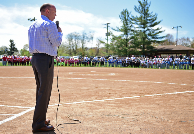 YOUNGSTOWN, OHIO - APRIL 23, 2017: Mayor John McNally speaks at the microphone during the Mill Creek Junior Baseball opening ceremonies, Sunday afternoon at the Mill Creek baseball field complex. DAVID DERMER | THE VINDICATOR