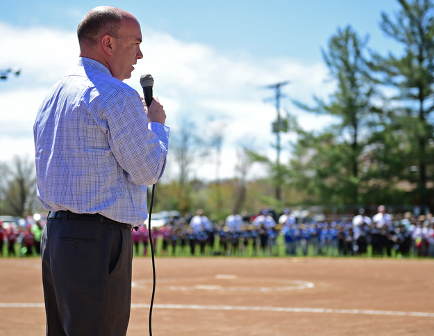 YOUNGSTOWN, OHIO - APRIL 23, 2017: Mayor John McNally speaks at the microphone during the Mill Creek Junior Baseball opening ceremonies, Sunday afternoon at the Mill Creek baseball field complex. DAVID DERMER | THE VINDICATOR