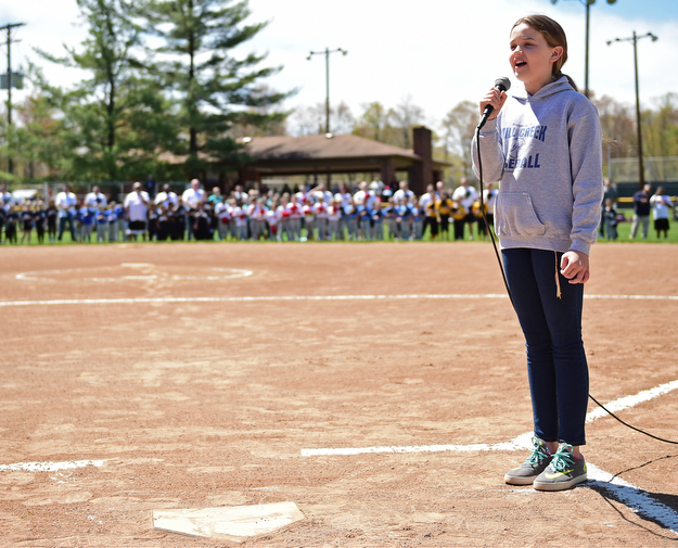 YOUNGSTOWN, OHIO - APRIL 23, 2017: Michaylen Lewis sings the national anthem during the Mill Creek Junior Baseball opening ceremonies, Sunday afternoon at the Mill Creek baseball field complex. DAVID DERMER | THE VINDICATOR
