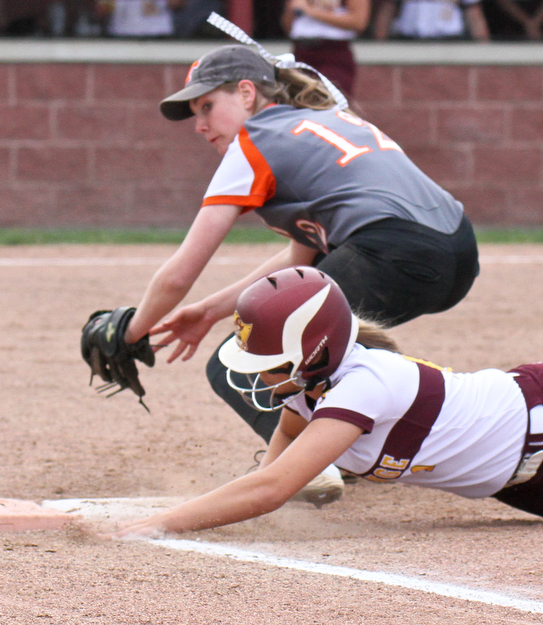 William D Lewis the vindicator   South Ranges Morgan Smith(11) dives back to first to avoid the pickoff as Springfield's Jacqueline Kish(12) tries to make the tag during 4-24-17 action at South Range.