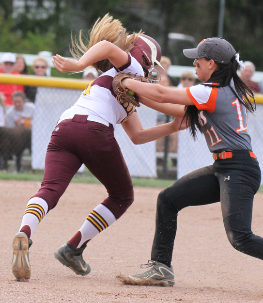 William D. Lewis the vindicator South Range's Morgan Smith(11) is tagged in a run down between 1rst & 2nd by Springfield's Nikki Bovo(11) during 4-24-17 action at South Range.
