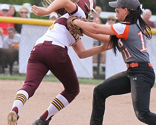William D. Lewis the vindicator South Range's Morgan Smith(11) is tagged in a run down between 1rst & 2nd by Springfield's Nikki Bovo(11) during 4-24-17 action at South Range.