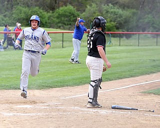 Poland's Dan Klase(24) steps onto home as Canfield catcher Angelo Petracci(25) waits for the ball during the 1st inning as Poland High School takes on Canfield High School, Tuesday, March 25, 2017 at Phil Bova Field. Poland won 9-1...(Nikos Frazier | The Vindicator)..