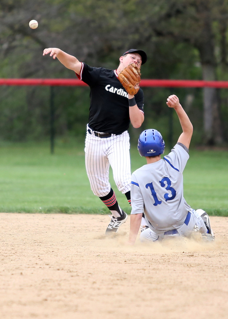 Poland's Vince Garayua(1) slides into second as Canfield second baseman Anthony Vross(24) throws to second during the 4th inning as Poland High School takes on Canfield High School, Tuesday, March 25, 2017 at Phil Bova Field. Poland won 9-1...(Nikos Frazier | The Vindicator)..