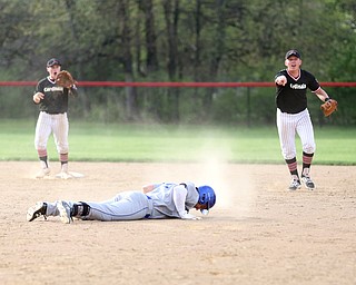 Poland's Braden Olson(22) lays on the ground after tripping while running to second base during the 6th inning as Poland High School takes on Canfield High School, Tuesday, March 25, 2017 at Phil Bova Field. Poland won 9-1...(Nikos Frazier | The Vindicator)..
