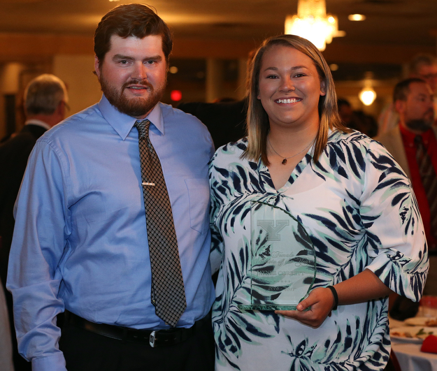 MICHAEL G TAYLOR | THE VINDICATOR- 04-26-17 Youngstown State University (YSU)  Scholar-Athlete Banquet at The Georgetown in Boardman, OH.  The Female Athlete of the Year Jaynee Corbett (right) stands with her Assistant Track and Field Coach (Throws) John Seaver (left).