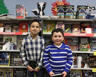 Neighbors | Abby Slanker.Two Hilltop Elementary School first-grade students enjoyed browsing through the variety of books available at the school’s annual book fair with the theme “S’more Fun with Books!” on March 16.