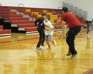 Neighbors | Alexis Bartolomucci.A Mooney student cheered on his team as two younger students spider-raced during the Mooney Olympics at the 5th and 6th Grade Day on March 31.