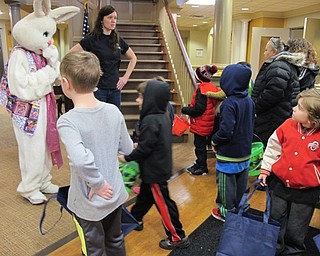 Neighbors | Alexis Bartolomucci.Children gathered around the Easter Bunny at the Commons at Greenbriar on April 1 as they waited to start their egg hunt.