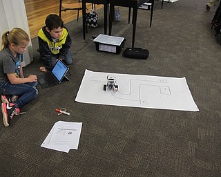 Neighbors | Alexis Bartolomucci.Children used the Lego Mindstorms Robots set at the Poland library to complete different assignments on March 29.