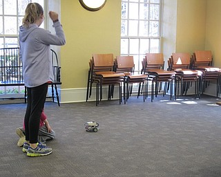 Neighbors | Alexis Bartolomucci.Children paired up to use Lego Mindstorms Robots to complete different tasks at the Poland library on March 29.