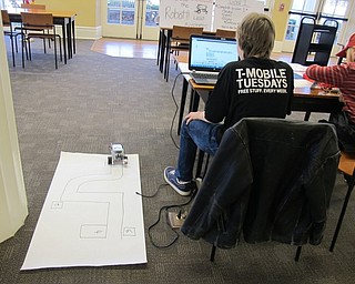 Neighbors | Alexis Bartolomucci.Children worked together to program their Lego Mindstorms Robots at the Poland library on March 29.