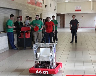 Neighbors | Abby Slanker.After a press conference to highlight the importance of STEM education through FIRST, members of the Canfield Circuit Birds brought out their robot to demonstrate how it shoots large round discs high into the air on March 27.