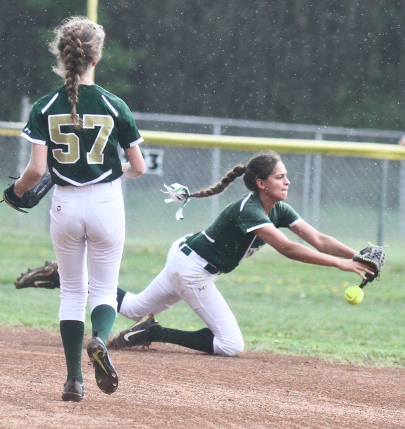 William D. Lewis The Vindicator Ursuline's Destiny Goodnight (7) looses a flyball during a 4-27-17 game at Champion. At left is Caroline Aey(57).