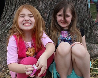 Neighbors | Abby Slanker.Kayleigh (left) and Abby Gonter checked out their stash of eggs, candy and raffle tickets after participating in the Canfield Dairy Queen’s annual Easter Egg Hunt on the green on April 15.
