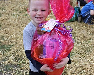 Neighbors | Abby Slanker.Cameron Hahn of Austintown beamed after winning a prize bucket full of bubbles and other toys and a coupon for a Blizzard at the Canfield Dairy Queen’s annual Easter Egg Hunt on the green on April 15.