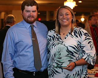 MICHAEL G TAYLOR | THE VINDICATOR- 04-26-17 Youngstown State University (YSU)  Scholar-Athlete Banquet at The Georgetown in Boardman, OH.  The Female Athlete of the Year Jaynee Corbett (right) stands with her Assistant Track and Field Coach (Throws) John Seaver (left).