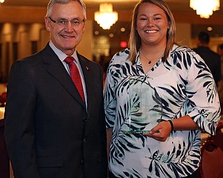 MICHAEL G TAYLOR | THE VINDICATOR- 04-26-17 Youngstown State University (YSU)  Scholar-Athlete Banquet at The Georgetown in Boardman, OH.  The Female Athlete of the Year Jaynee Corbett (right) stands with YSU President Jim P. Tressel (left).