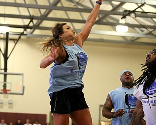 YPD Officer Jessica Shields(blue) goes up for the layup during the Battle of the Blue charity basketball event benefiting the Mahoning County Children's Services, Friday, April 28, 2017 at the Arlington Heights Recreation Center in Youngstown. ..(Nikos Frazier | The Vindicator)..