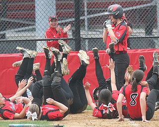 William d Lewis the vindicator  Canfield players do their home run drill as Kalin Kovach crosses the plate for one of her two homers during 4-28-17 game with Fitch.