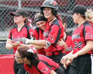 William d Lewis the vindicator  Canfield's Kalin Kovach(20) , center,  get conrats from team mates from left McKenna Carey, Mallory Vaclav, Chloe Cruz and Sydney Fabry(2) bottom, after hitting one of her 2 homers 4-28-17 game with Fitch.