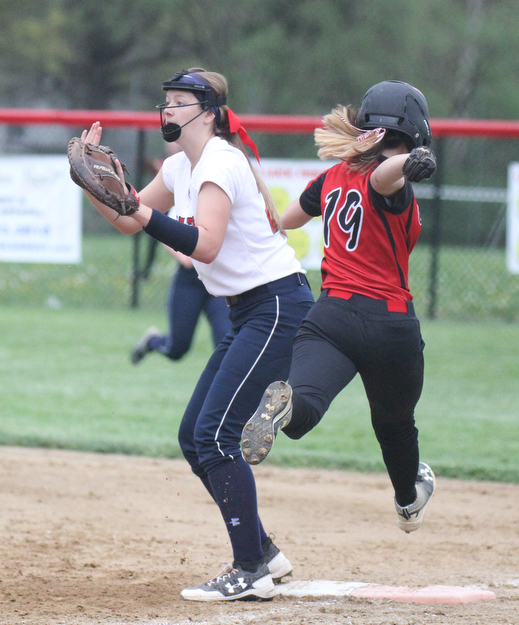 William d Lewis the vindicator  Canfield's Savannah Maass(19) is safe at first as fitch'sMcKenzie Luknis(22) waits for the throw during 4-28-17 game.