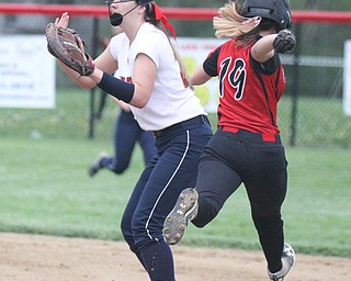 William d Lewis the vindicator  Canfield's Savannah Maass(19) is safe at first as fitch'sMcKenzie Luknis(22) waits for the throw during 4-28-17 game.