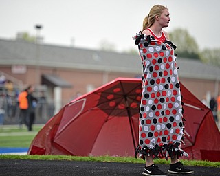 POLAND, OHIO - APRIL 29, 2017: Badger's Shania Marshall stands while wrapped in a blanket while waiting for her turn to high jump , Saturday morning during the Poland Invitational at Poland High School. DAVID DERMER | THE VINDICATOR