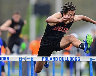 POLAND, OHIO - APRIL 29, 2017: Howland's Jacob Williams clears a hurdle during his heat of the boys 110 meter hurdles, Saturday morning during the Poland Invitational at Poland High School. DAVID DERMER | THE VINDICATOR