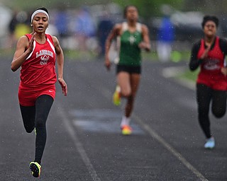 POLAND, OHIO - APRIL 29, 2017: LaBrae's Dynesty Ervin sprints to the finish line ahead of St. Vincet-St. Mary's Payton Pooler and Struthers Khaylah Brown during their heat of the girls 200 meter dash, Saturday morning during the Poland Invitational at Poland High School. DAVID DERMER | THE VINDICATOR