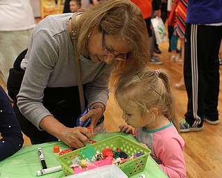 Jolie MasDougall of Youngstown makes a craft with her granddaughter Savannah (3) during the "Plant a seed to Read" event at the Fellows Riverside Gardens of Mill Creek Park on Saturday morning.  Dustin Livesay  |  The Vindicator  4/29/17  Mill Creek Park.