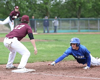 Poland runner Braden Olson(22) dives back to first as Boardman first baseman Evan Kraus(17) waits for the passduring the 1st inning as Boardman takes on Poland, Tuesday, May 2, 2017 at Cene Park. ..(Nikos Frazier | The Vindicator)..