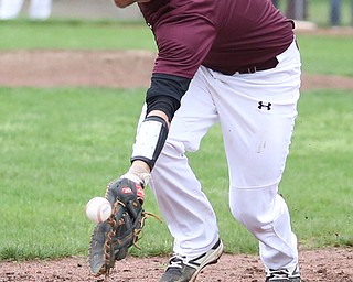 Boardman first baseman Evan Kraus(17) leans out to catch a pass during the 1st inning as Boardman takes on Poland, Tuesday, May 2, 2017 at Cene Park. ..(Nikos Frazier | The Vindicator)..
