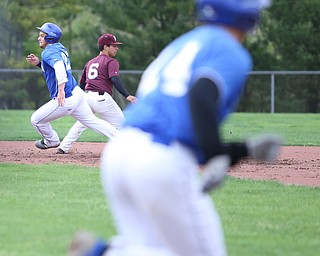 Poland runner Padraig O'Shaughnessy(21) runs past second base during the 1st inning as Boardman takes on Poland, Tuesday, May 2, 2017 at Cene Park. ..(Nikos Frazier | The Vindicator)..
